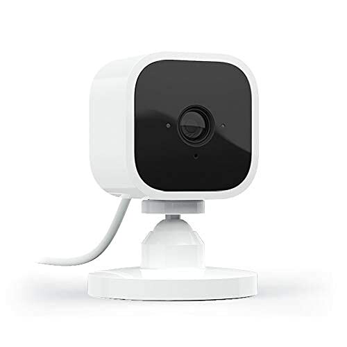 Compact white security camera with black faceplate on a stand