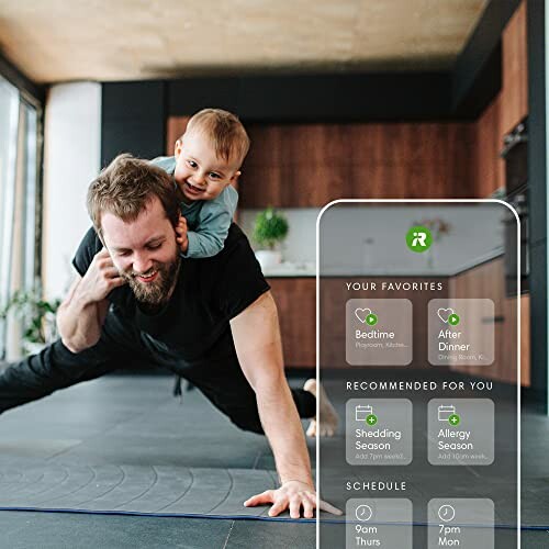 Father exercising with baby on his back at home.