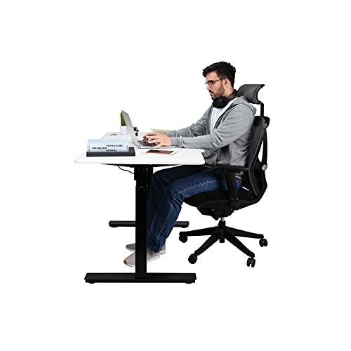 Man sitting at a desk using a computer