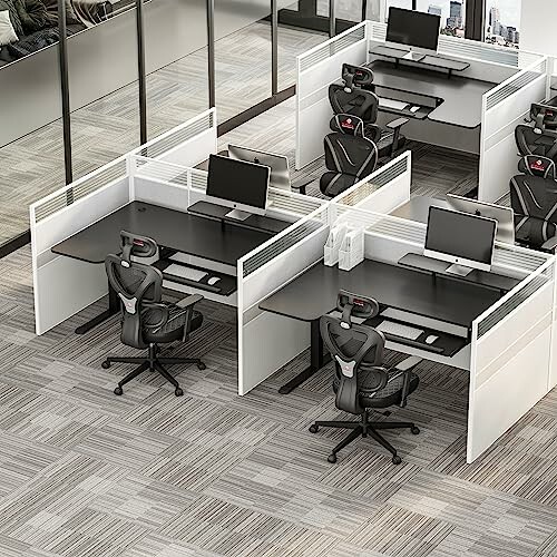 Modern office workstations with ergonomic chairs and computer setups.