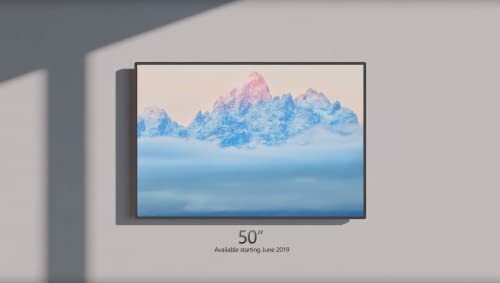 50-inch TV displaying a snowy mountain landscape.