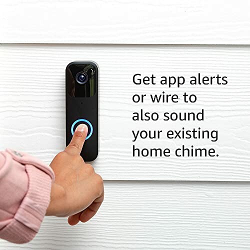 Person pressing a smart doorbell with app alerts option