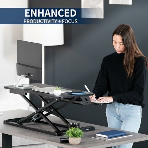 Person using a standing desk with enhanced productivity and focus.