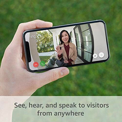 Person holding smartphone showing a video call with a woman waving